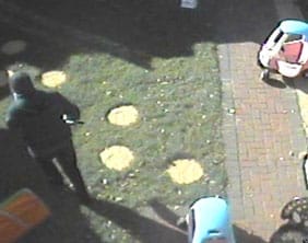 Gunman3 The gunman strolls past toys belonging to Richard Deakin's children after shooting the father-of-two dead