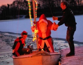 SantaAndGaryElf2 Santa and his elf are helped off their boat