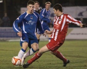 A challenge comes in on Chasetown's Grant Ryan. Pic: Dave Birt