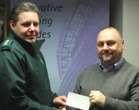 Rob Harrison presenting a cheque to Matt Heward