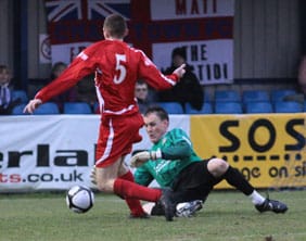 Richard Davies skips round the keeper before scoring against Eastleigh. Pic: Dave Birt