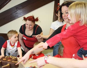 Busy Bees Nursery children judge the Gruffalo cakes made by staff