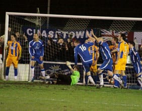 Chasetown players celebrate their last-gasp equaliser against Mansfield Town. Pic: Dave Birt