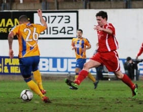 Danny Smith closes Ashley Cain down. Pic: Dave Birt