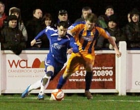 Chasetown striker Dean Perrow races away from a defender. Pic: Dave Birt