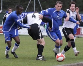 Gary Birch and Ramone Stephens battle for the ball. Pic: Dave Birt
