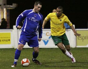 Gary Birch holds the ball under pressure from a Northwich Victoria defender. Pic: Dave Birt