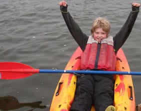 Jack-competing-in--11-13yr-age-group One of the competitors celebrates completing the boating course at Chasewater