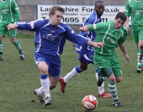 john-branch-retuns-to-the-starting-line-up John Branch battles for the ball. Pic: Dave Birt