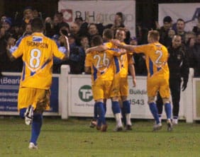 Mansfield Town players celebrate after going 2-1 in front. Pic: Dave Birt