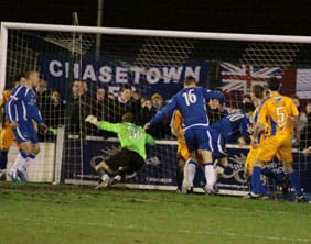 Mansfield Town keeper David Grof fumbles Richard Davies' corner into his own net. Pic: Dave Birt