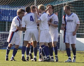 Whitby Town's players celebrate the equaliser. Pic: Dave Birt