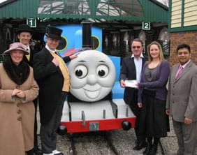 Representatives from JDRF receive the cheque from Drayton Manor Park staff