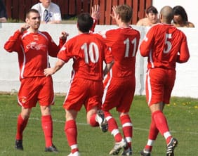 Richard Davies celebrates opening the scoring for Chasetown. Pic: Dave Birt
