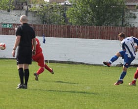 Grant Darley fires home Frickley's equaliser. Pic: Dave Birt
