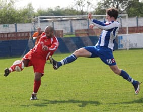 Chasetown's Jimmy Turner clears the ball. Pic: Dave Birt