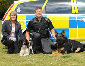 Maggie Gwynne and PC Steve Cartlidge with Jasper and Echo