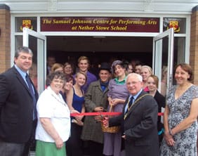 Cllr Brian Bacon cuts the ribbon on the Samuel Johnson Centre for Performing Arts