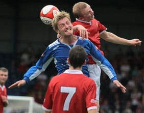 Ben Jevons battles for the ball in the air. Pic: Dave Birt
