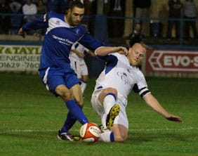 Richard Teesdale slides in to make a tackle. Pic: Dave Birt