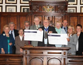 Barry Diggle hands over the cheques