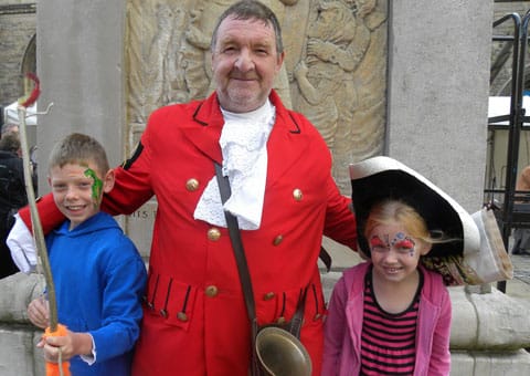 Town crier Ken Knowles with Ethan and Ellie-Mae Bogacki