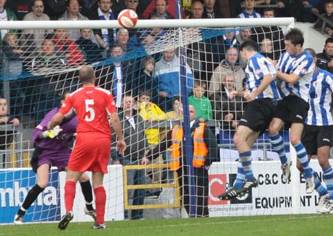 Michael Wilde heads home a later winner for Chester against Chasetown. Pic: Dave Birt Michael Wilde heads home a later winner for Chester against Chasetown. Pic: Dave Birt
