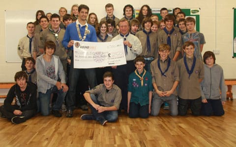 Julian Webb hands over the cheque to Lichfield Explorer Scouts and their leader Nigel Theaker