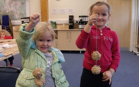 Alexis Brown-Powell and Alicia Brown-Powell with their birdfeeders