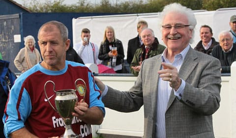 colin-gibson-recieves-the-cutting-cup-from-mike-joiner