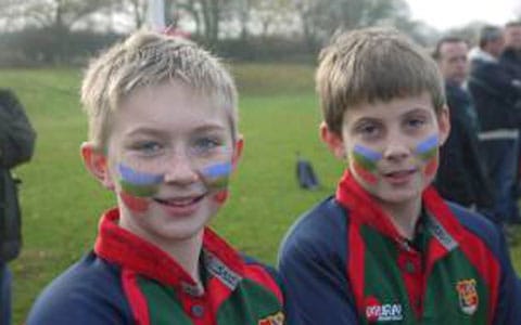 Young rugby players with their faces painted