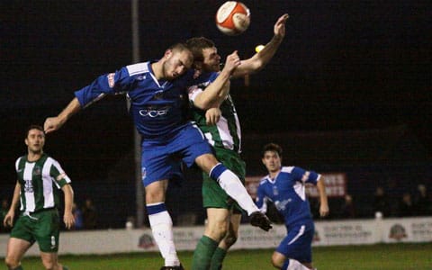 Karl Edwards battles for the ball in the air. Pic: Dave Birt