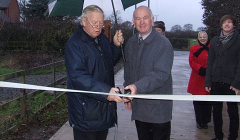 Cllr Neil Roberts and Dave Henn cutting the ribbon Cllr Neil Roberts and Dave Henn cutting the ribbon