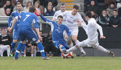 Dean Perrow battles for the ball. Pic: Dave Birt