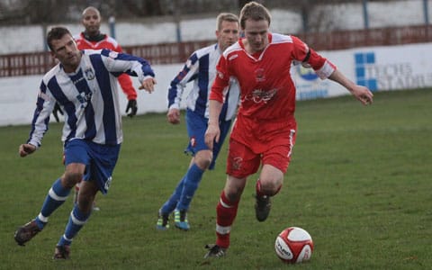 Mark Hands gets away from a Frickley Athletic player. Pic: Dave Birt Mark Hands gets away from a Frickley Athletic player. Pic: Dave Birt