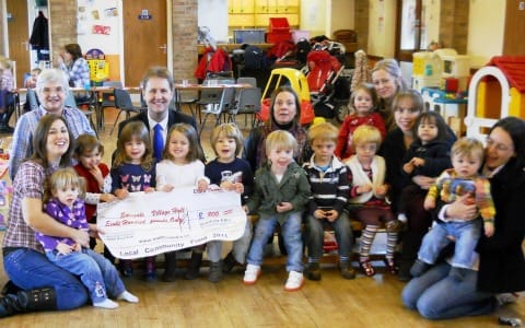 Cllr Matthew Ellis presents the cheque at Edingale Village Hall