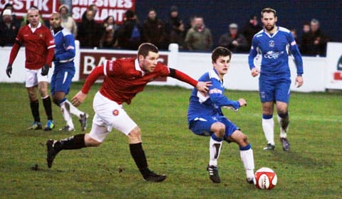 casper-hughes-lays-the-ball-off