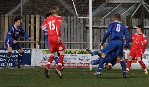 Dean Perrow's effort is scrambled away by the Whitby defence. Pic: Dave Birt