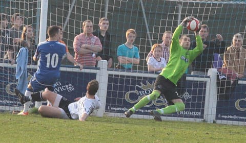 Dean Perrow's effort is saved by the Buxton keeper. Pic: Dave Birt