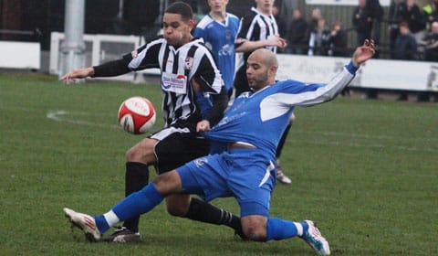 Jimmy Turner slides in to win the ball. Pic: Dave Birt