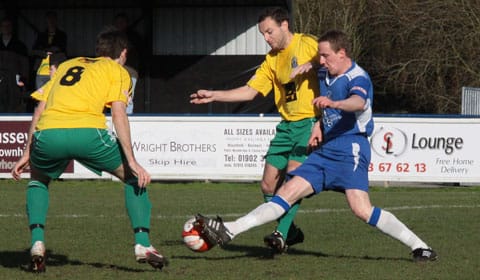 Chasetown FC's Mark Hands battles for the ball. Pic: Dave Birt