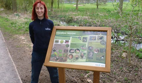 Ruth Witczak with the new Woodland Habitat board in Beacon Park
