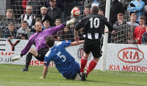 Chasetown FC goalkeeper Lee Evans is beaten by Steve Foster. Pic: Dave Birt
