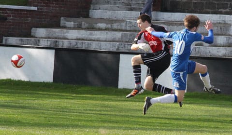 the-keeper-clears-but-strikes-his-own-defender