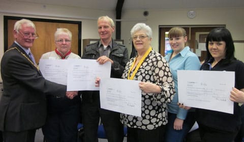 Cllr Eric Drinkwater handing over the cheques Cllr Eric Drinkwater handing over the cheques