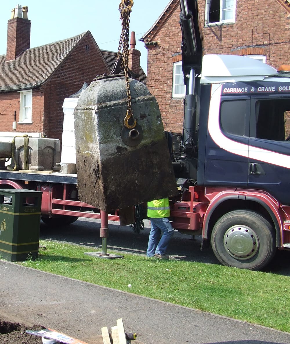 Well head being lifted - the dark line shows how much had been buried