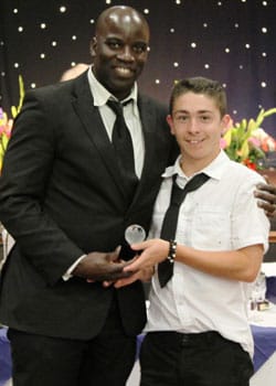 chad_degville_presents_reserve_team_manager_andy_penny_with_a_trophycelebrating_an_undefeated_midland_combination_season