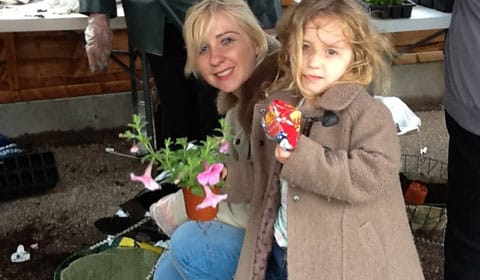 Two Friday Acre residents putting a hanging basket together