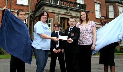 Stacey Smalley receives the cheque from Maple Hayes students