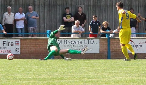 Russell Dunkley puts King's Lynn 1-0 up against Chasetown. Pic: Dave Birt